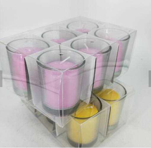 Multi-colored votive candle with glass holder