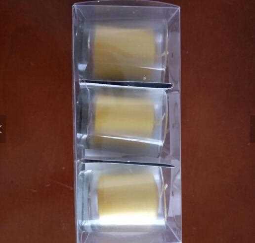 Multi-colored votive candle with glass holder