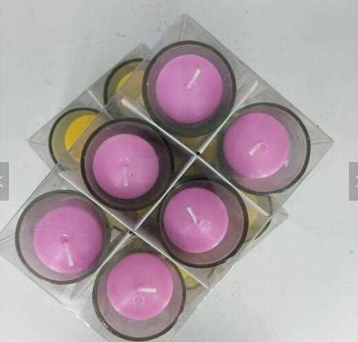 Multi-colored votive candle with glass holder