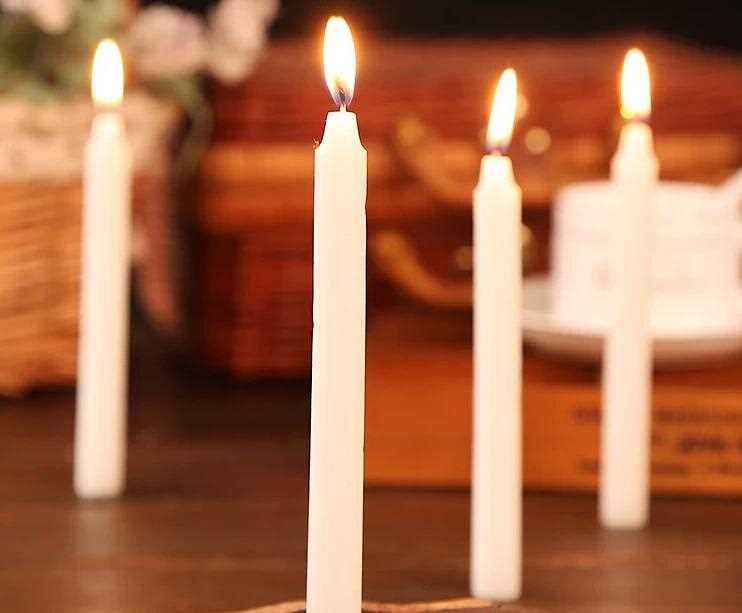 Multi-colored paraffin wax tall taper candle